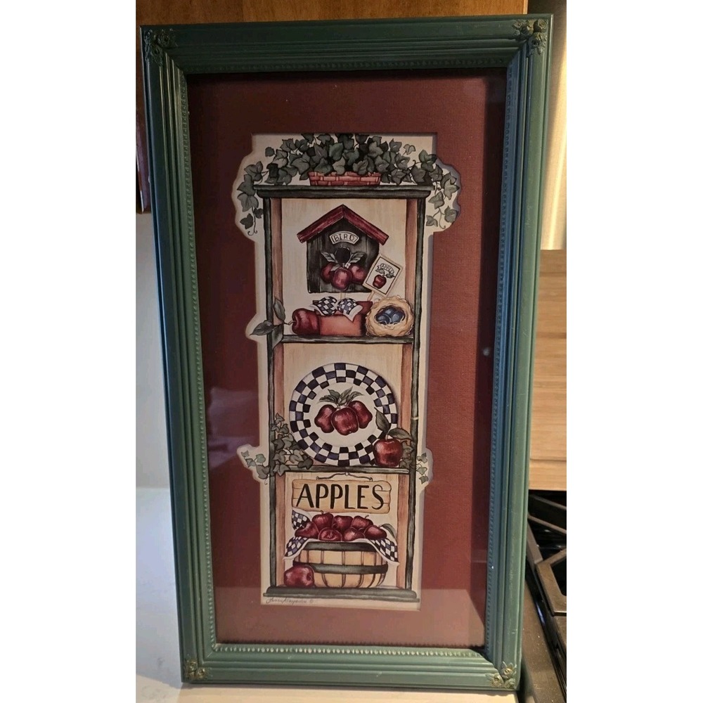 The artwork is titled "APPLES" and features a signature from artist Laurie...